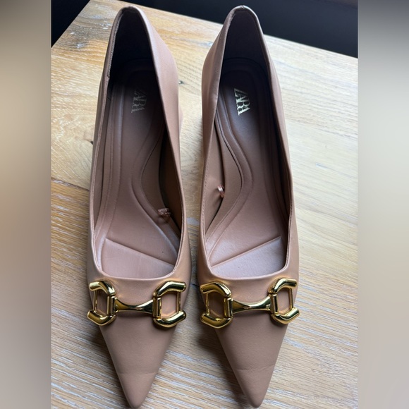 Zara Shoes - Like new Zara nude pointed-toe pumps with a gold-tone snaffle buckle detail. 9